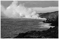 Clouds of smoke and steam produced by lava flowing into ocean. Hawaii Volcanoes National Park, Hawaii, USA. (black and white)