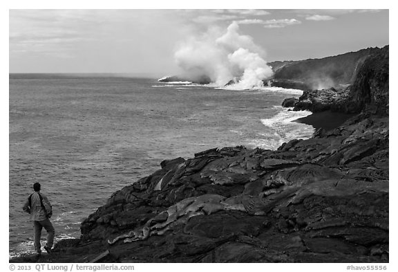 Park visitor looking, lava ocean entry plume. Hawaii Volcanoes National Park, Hawaii, USA.