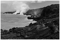 Molten lava flow and ocean plume. Hawaii Volcanoes National Park, Hawaii, USA. (black and white)