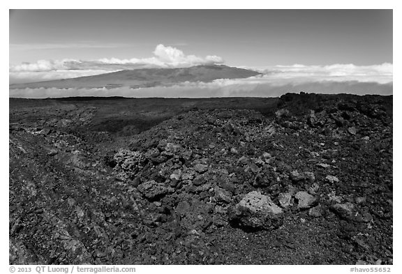 Vein of red and orange lava on Mauna Loa, Mauna Kea in background. Hawaii Volcanoes National Park, Hawaii, USA.