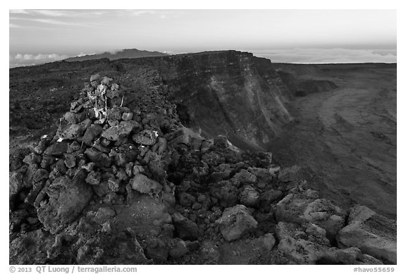 Summit cairn and crater at dusk. Hawaii Volcanoes National Park, Hawaii, USA.