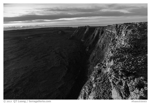 Cliffs bordering Mauna Loa summit caldera from rim at sunrise. Hawaii Volcanoes National Park (black and white)