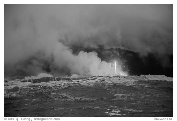 Lava flows creating huge clouds of hydrochloric steam upon meeting with ocean. Hawaii Volcanoes National Park, Hawaii, USA.