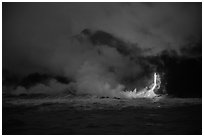 Lava flow seen from the ocean at dawn. Hawaii Volcanoes National Park, Hawaii, USA. (black and white)
