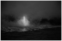 Lava flow at dawn, ocean reflection, and steam plume. Hawaii Volcanoes National Park, Hawaii, USA. (black and white)