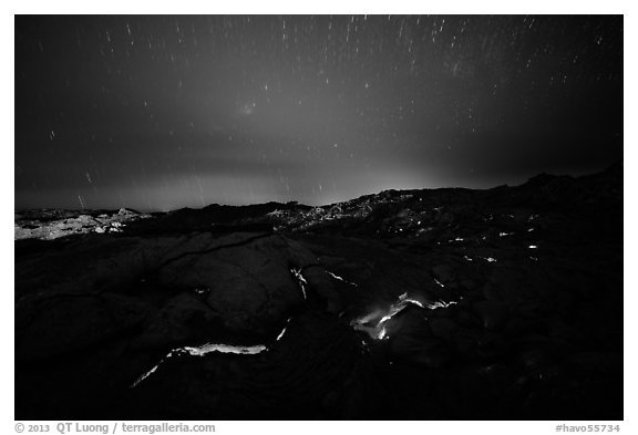 Molten lava flow with star trails. Hawaii Volcanoes National Park, Hawaii, USA.