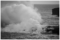 Lava reaching ocean from bench. Hawaii Volcanoes National Park ( black and white)