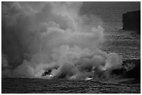 Lava ocean entry from low bench, dusk. Hawaii Volcanoes National Park ( black and white)