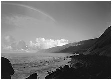 Rainbow and Mataalaosagamai sea cliffs in the distance, Tau Island. National Park of American Samoa ( black and white)