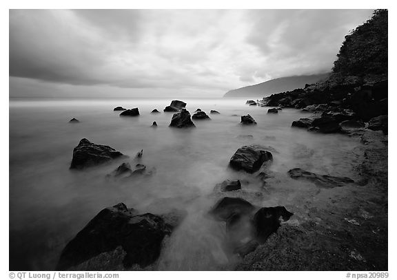 Seascape with smooth water, clouds and rocks, Siu Point, Tau Island. National Park of American Samoa (black and white)