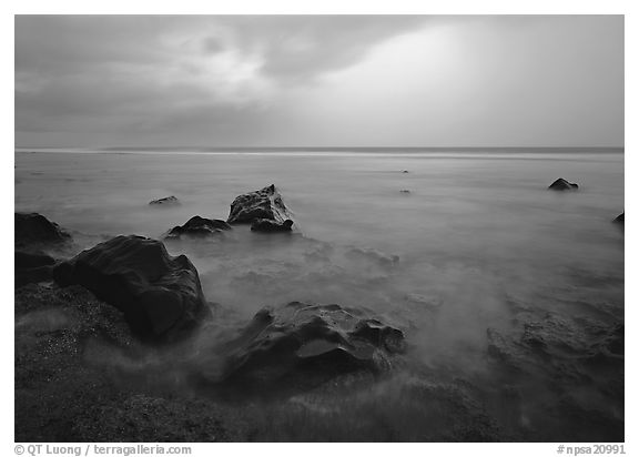 Rocks in water and approaching storm, Siu Point, Tau Island. National Park of American Samoa (black and white)