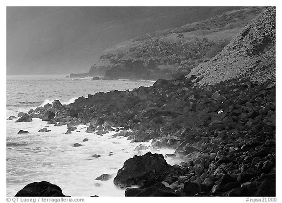 Coastline with Balsalt boulders on the wild South coast of Tau Island. National Park of American Samoa