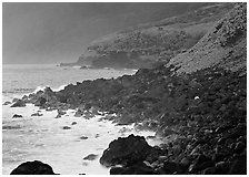 Coastline with Balsalt boulders on the wild South coast of Tau Island. National Park of American Samoa (black and white)