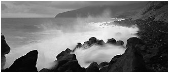 Shoreline with black rock pounded by strong surf, Tau Island. National Park of American Samoa (Panoramic black and white)