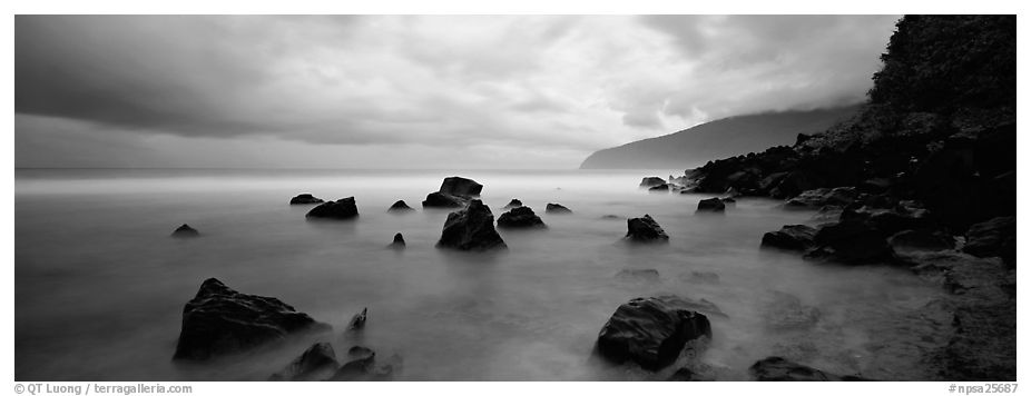 Coast with boulders and storm clouds, Tau Island. National Park of American Samoa (black and white)