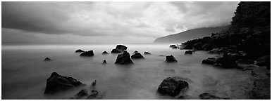 Coast with boulders and storm clouds, Tau Island. National Park of American Samoa (Panoramic black and white)