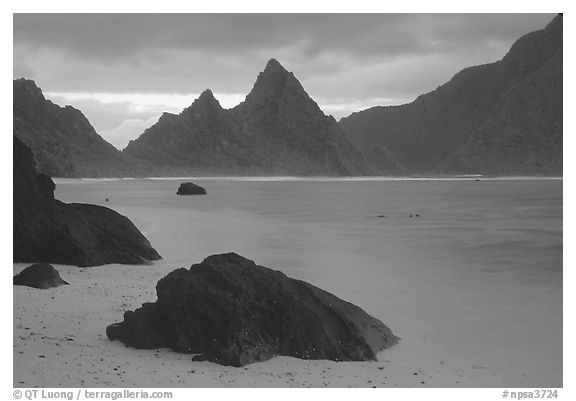 Balsalt boulders on South Beach, Sunuitao Peak in the background, Ofu Island. National Park of American Samoa (black and white)