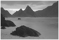 Balsalt boulders on South Beach, Sunuitao Peak in the background, Ofu Island. National Park of American Samoa ( black and white)