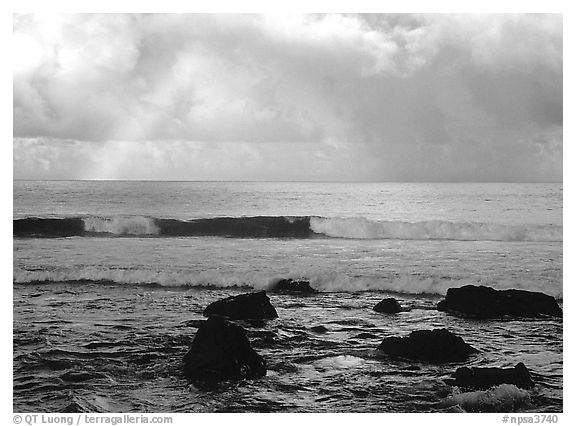 Rainbow and boulders, Siu Point, Tau Island. National Park of American Samoa (black and white)