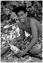 Samoan boy with fish, Tau Island. National Park of American Samoa (black and white)