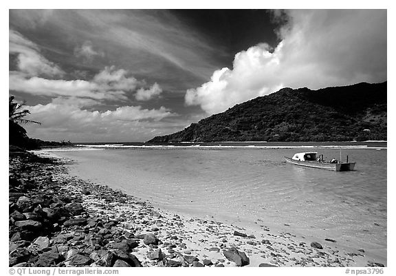 Fishing boat in Vatia Bay, mid-day, Tutuila Island. National Park of American Samoa