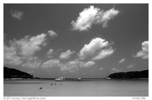 Saltpond bay beach with swimmers and boats. Virgin Islands National Park, US Virgin Islands.