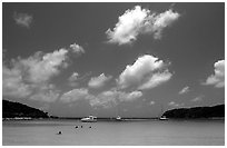 Saltpond bay beach with swimmers and boats. Virgin Islands National Park, US Virgin Islands. (black and white)