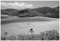 Turquoise waters in Francis Bay with anchored yacht. Virgin Islands National Park, US Virgin Islands. (black and white)