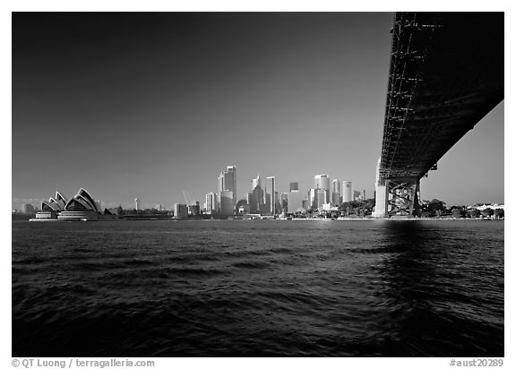 Harbor Bridge from below, skyline, and Opera House. Sydney, New South Wales, Australia (black and white)