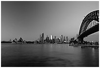 Harbour bridge, city skyline and opera house, dawn. Sydney, New South Wales, Australia (black and white)