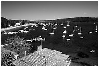 Yatchs anchored in the outskirts of the city. Sydney, New South Wales, Australia (black and white)