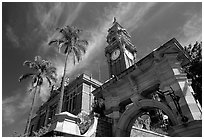 South Brisbane Town Hall, a red brick building with an ornate clock tower and archway. Brisbane, Queensland, Australia (black and white)