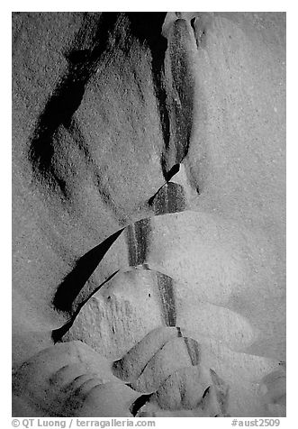 Rock sculptured by flash flood flows on Ayers Rock. Uluru-Kata Tjuta National Park, Northern Territories, Australia