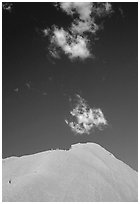 Hikers ascend Ayers Rock. Uluru-Kata Tjuta National Park, Northern Territories, Australia (black and white)