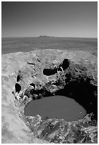 Green pool on Ayers Rock, Olgas in a distance. Uluru-Kata Tjuta National Park, Northern Territories, Australia ( black and white)