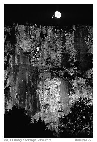 Rock climbing on the banks of the Brisbane River at night. Brisbane, Queensland, Australia