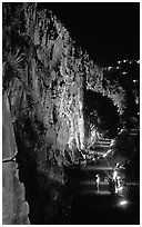 Rock climbing on the banks of the Brisbane River at night. Brisbane, Queensland, Australia (black and white)