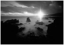 Sun shining brilliantly over primeval seascape, Kenae Peninsula. Maui, Hawaii, USA (black and white)