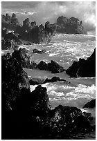 Sharp volcanic Rocks and surf, Keanae Peninsula. Maui, Hawaii, USA (black and white)