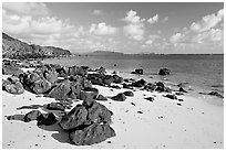 Volcanic rocks and beach, near Makai research pier,  early morning. Oahu island, Hawaii, USA (black and white)