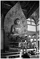 Amida seated on a lotus flower, the largest Buddha statue carved in over 900 years, Byodo-In Temple. Oahu island, Hawaii, USA (black and white)