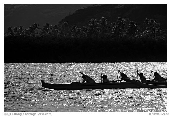 Backlit outrigger canoe, Maunalua Bay, late afternoon. Oahu island, Hawaii, USA