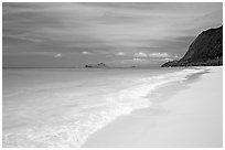 Sand, turquoise waters, and pali, Waimanalo Beach. Oahu island, Hawaii, USA (black and white)