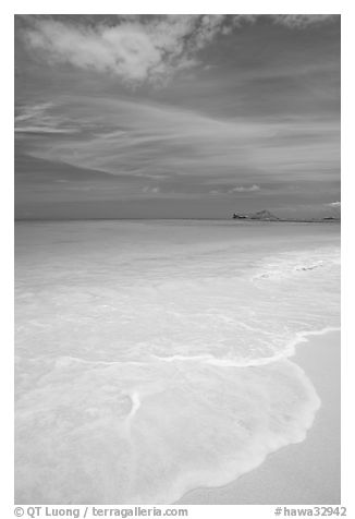 Foam, sand, and turquoise waters, Waimanalo Beach. Oahu island, Hawaii, USA (black and white)