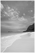 Sand, turquoise waters, and cliff, Waimanalo Beach. Oahu island, Hawaii, USA (black and white)