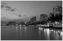 Waterfront and high-rise hotels at dusk. Waikiki, Honolulu, Oahu island, Hawaii, USA (black and white)