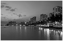 Waterfront and high-rise hotels at dusk. Waikiki, Honolulu, Oahu island, Hawaii, USA (black and white)