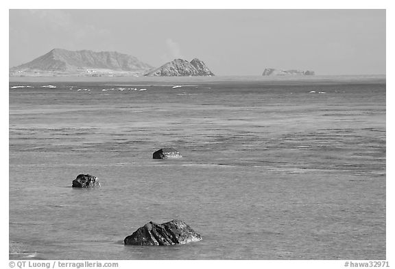 Rocks and turquoise waters near Makai research pier. Oahu island, Hawaii, USA (black and white)