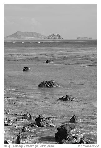 Rocks and turquoise waters near Makai research pier. Oahu island, Hawaii, USA (black and white)