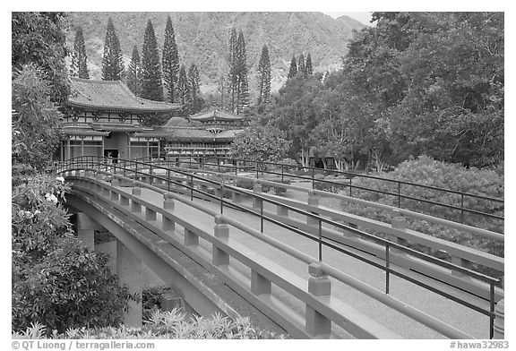 Red bridge leading to Byodo-In Temple. Oahu island, Hawaii, USA